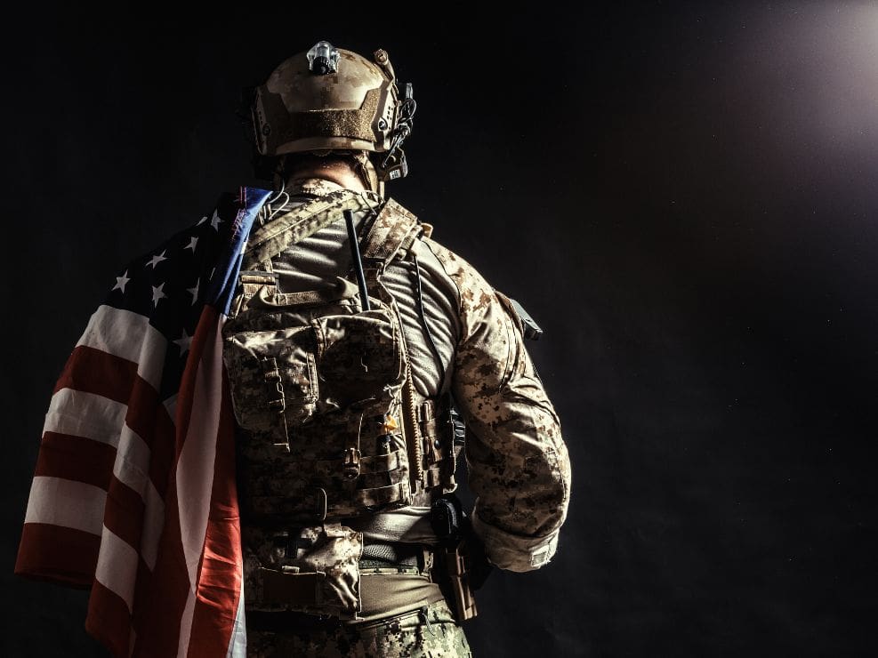 US Flag draped over US soldier